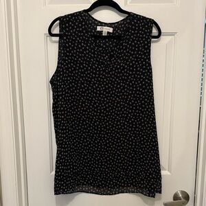 Black Sleeveless Blouse with White Pattern
